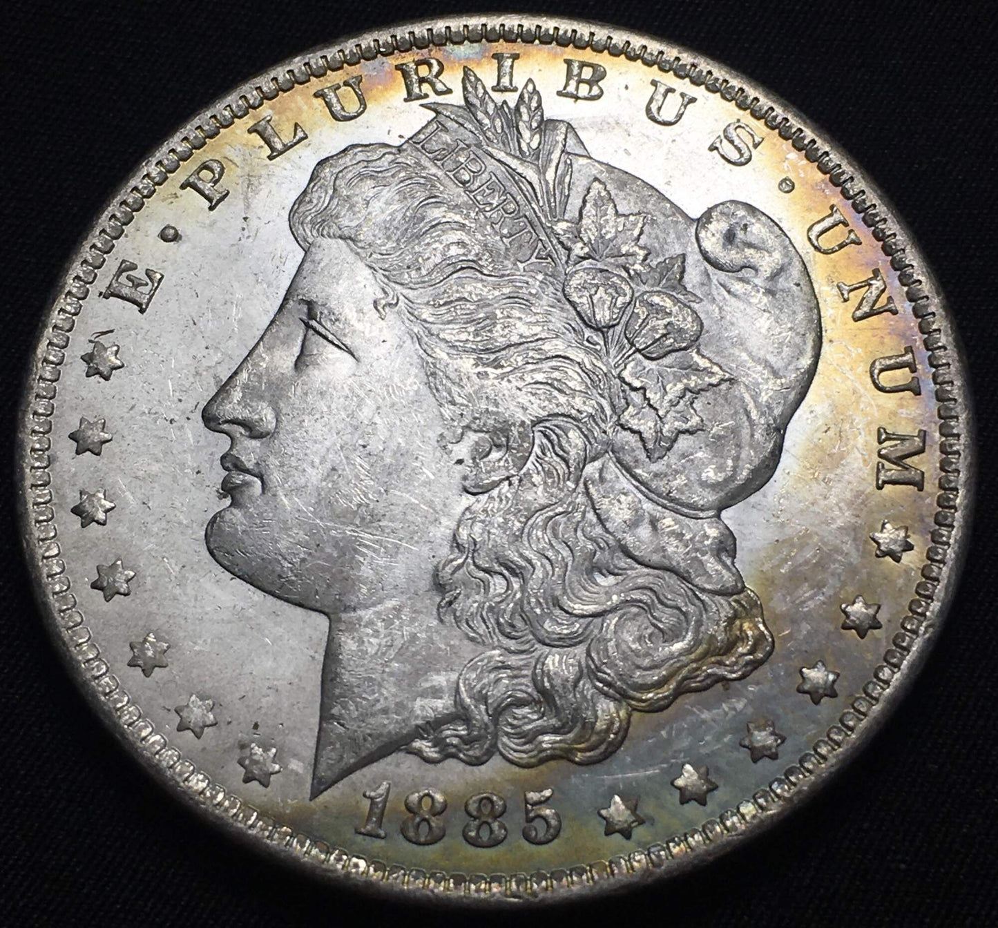 1885-O Morgan Silver Dollar - Rainbow Toning on Rim