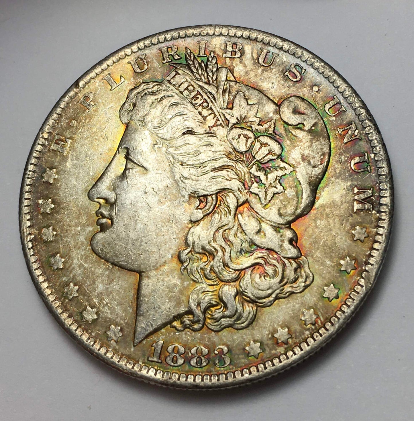 1883-O Morgan Silver Dollar BU with Rainbow and Seafoam Green Toning