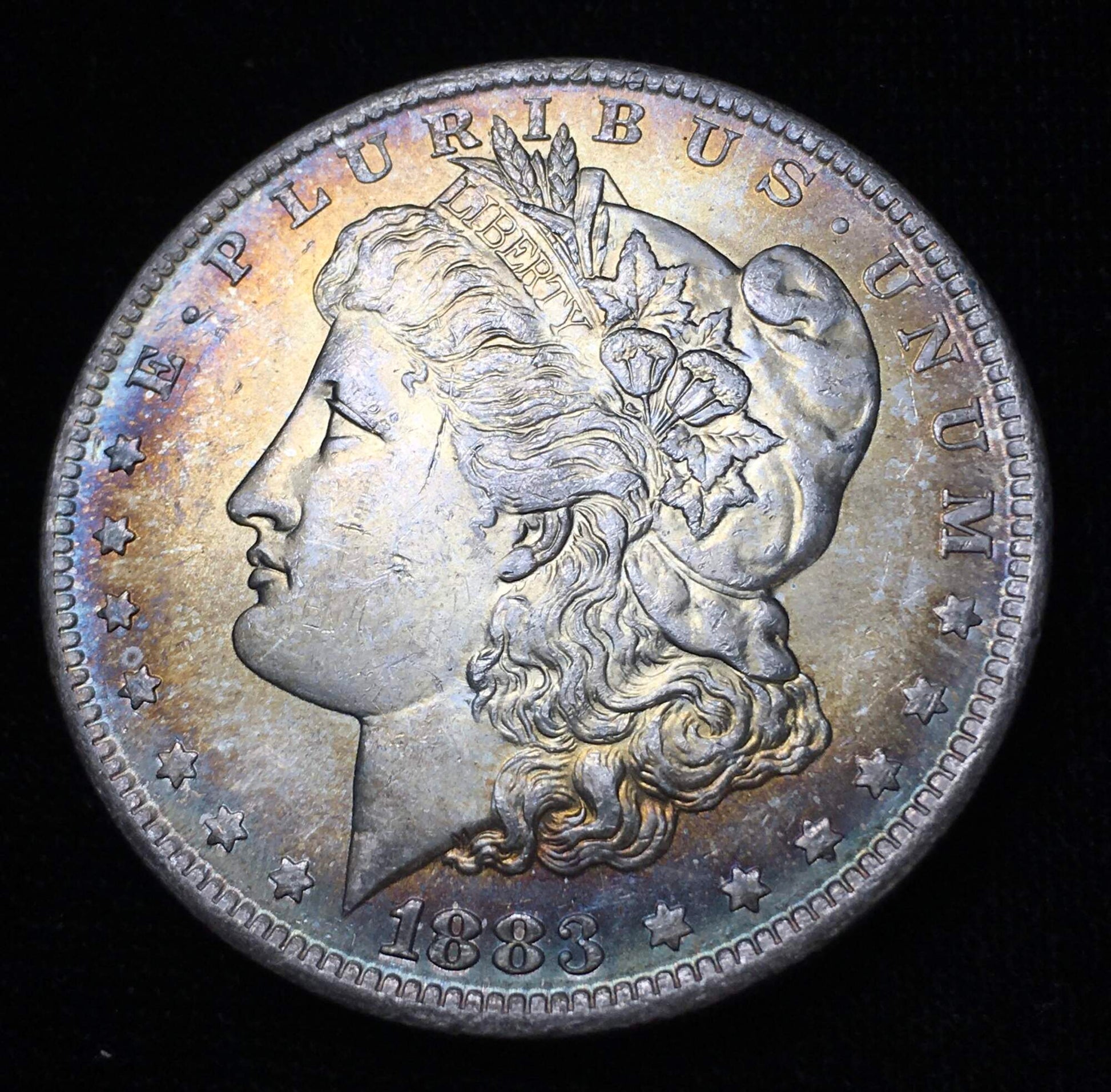 1883-O Morgan Silver Dollar BU - Obverse Rainbow Toning